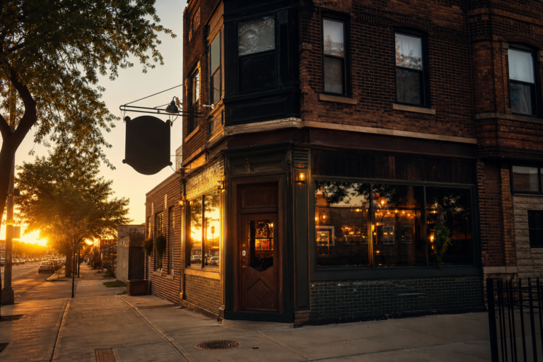 A brick corner tavern building in Chicago at golden hour